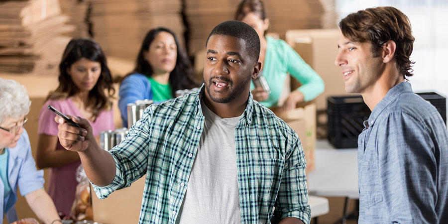 A humanities career example of a community service manager organizing a food bank event.